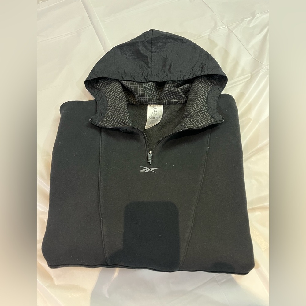 Reebok Black Thermowarm Jacket
Hood lining feature a black & silver grid pattern